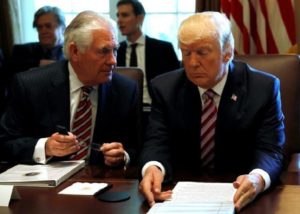U.S. President Trump talks with Secretary of State Tillerson during a meeting with members of his Cabinet at the White House in Washington