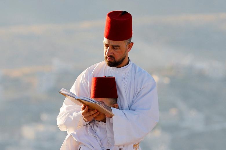 دیدنی های امروز؛ از آلودگی های محیط زیستی تا پایان قرنطینه در چین اعضای فرقه "سامری" در یک زیارت سنتی به مناسبت جشن "شاووت"