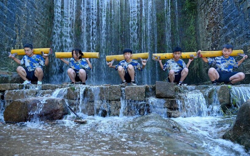 دیدنی های امروز؛ از سیل کره جنوبی تا اسب های وحشی اسپانیایی کودکان چینی در حال تمرین اسکوات